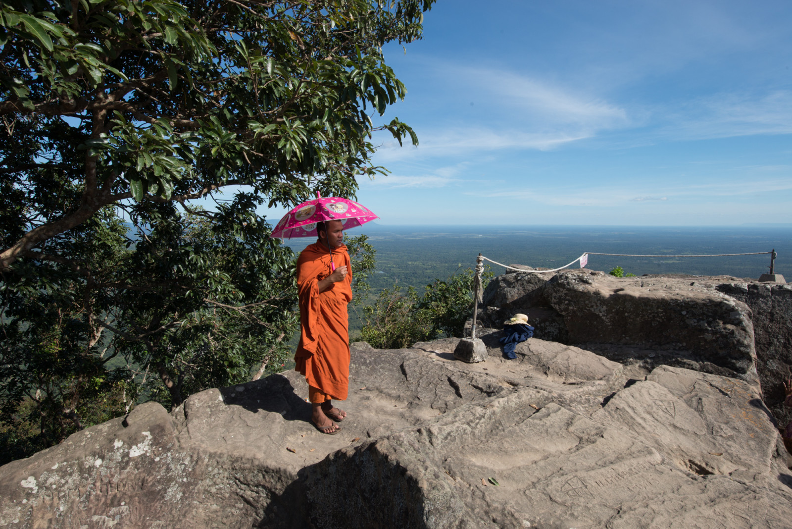 Cambodia photo tours Preah Vihear temple monk holding umbrella