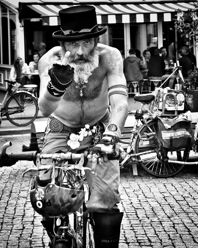 Cool dude in Amsterdam on bicycle