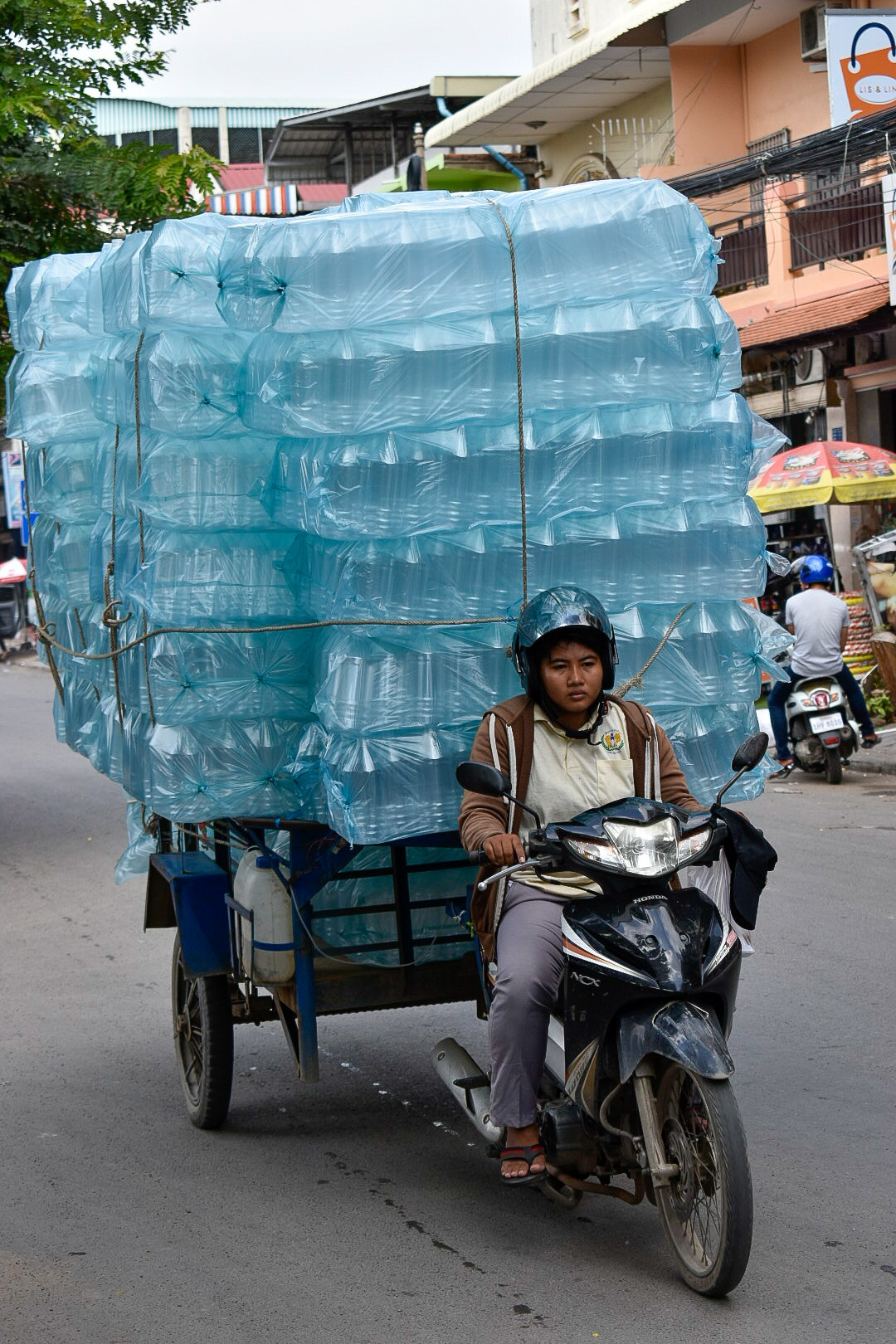 Phnom Penh plastics on motorbike