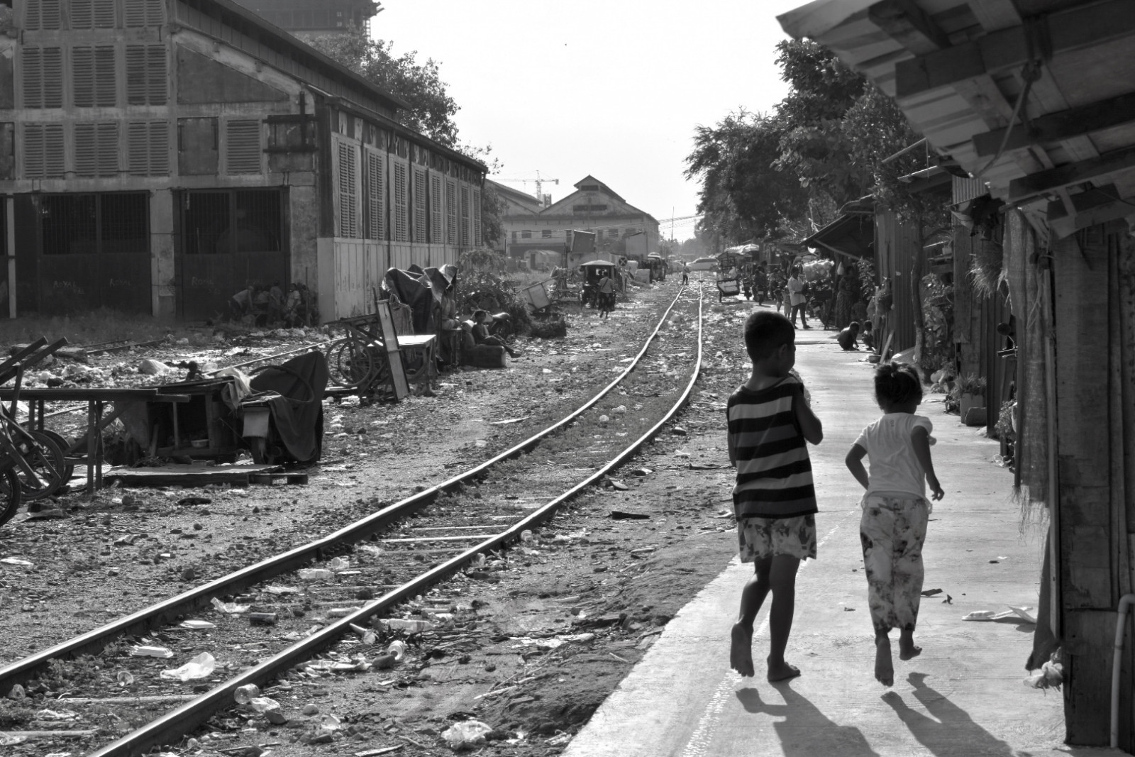 City of garbage Phnom Penh railroad tracks children playing