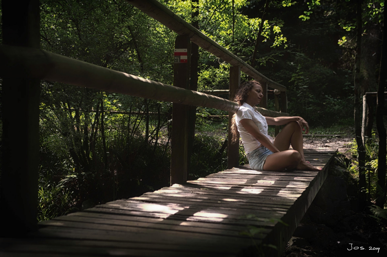 learn-about-composition-in-photography-lady-on-bridge-far-by-jos-joosten